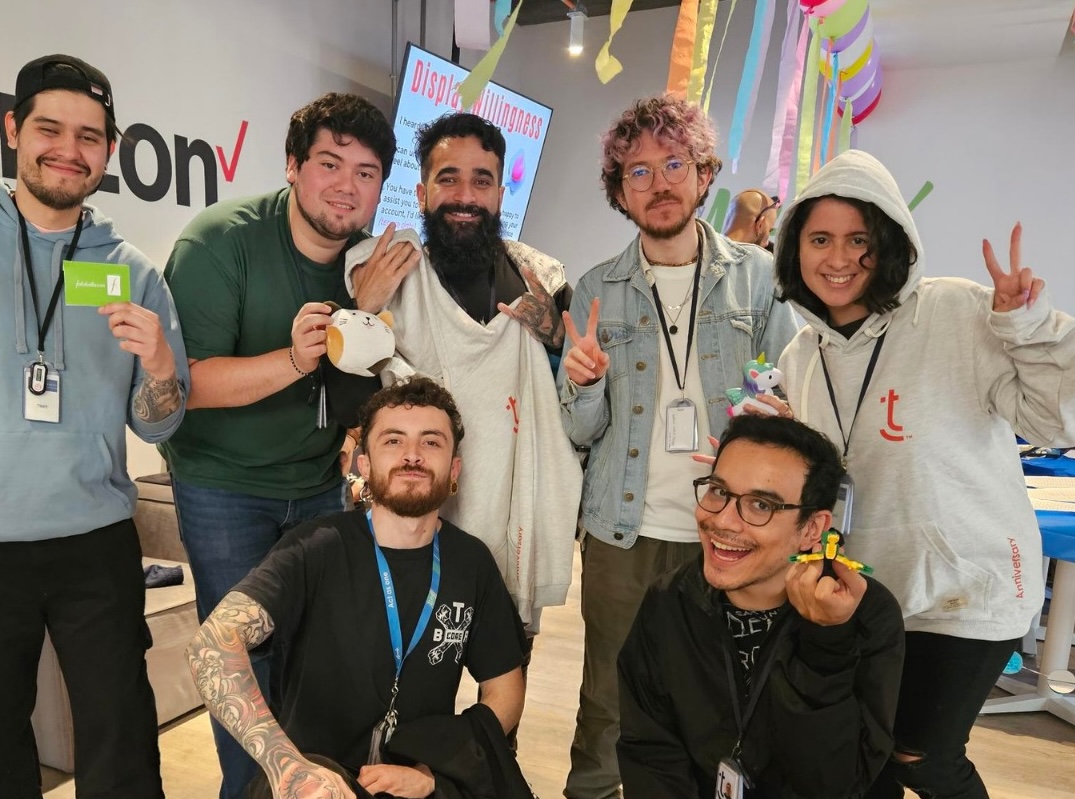 TTEC team all smiles, posing for a picture.